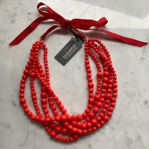 Red beaded necklace with ribbon